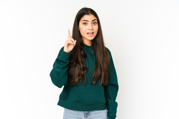 Young indian woman isolated on purple background having an idea, inspiration concept.