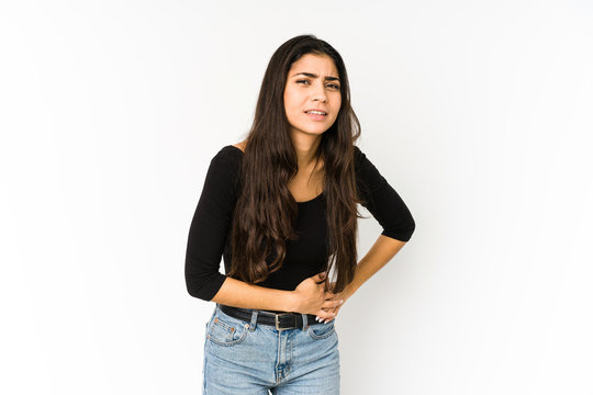 Young Indian Woman Isolated On Purple Background Having A Liver Pain, Stomach Ache.