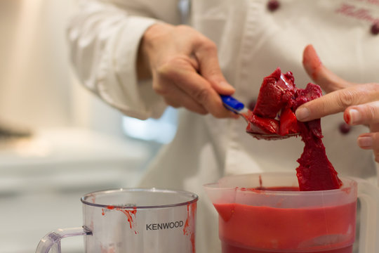 Details Of Preparing A Strawberry Cheescake In A Commercial Kitchen