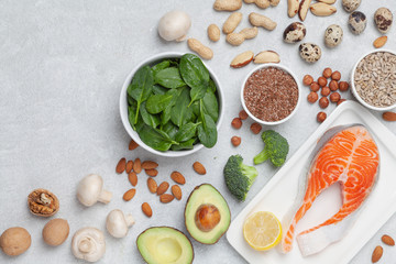 Ketogenic food ingredients. Keto diet concept. Balanced food background. Vegetables, fish, cheese, eggs and nuts. 