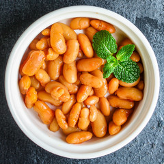 beans in tomato sauce, keto or paleo diet menu concept food background. top view. copy spaces