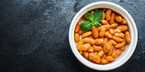 beans in tomato sauce, keto or paleo diet menu concept food background. top view. copy spaces