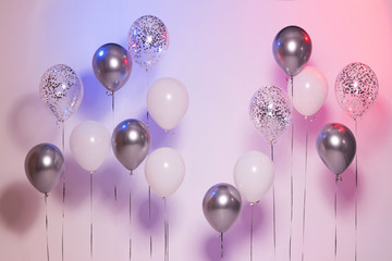 Holidays background with silver and white gel balls. Birthday  and happiness. Festive mood. 