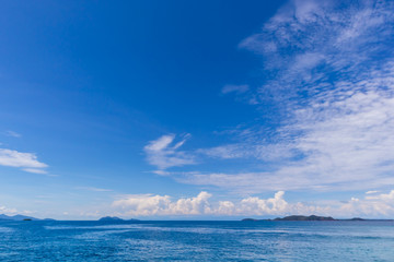 Blue sky with white cloud  and deep blue sea