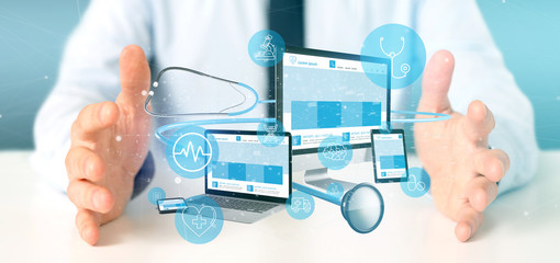 Businessman holding Devices with medical icon and stethoscope 3d rendering
