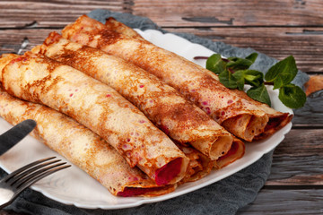 Pancakes with beetroot and cheese pasta and salmon