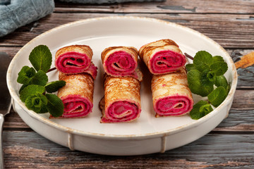 Pancakes with beetroot and cheese pasta and salmon