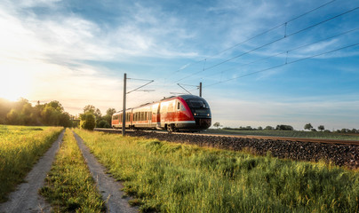 Passenger train on sunny day of summer in Germany - obrazy, fototapety, plakaty