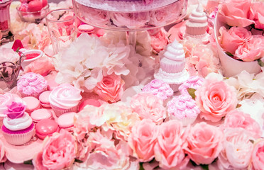 Obraz na płótnie Canvas pink decoration with pink dessert and pink flower