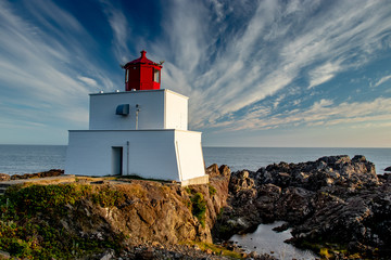 Clouds behind Amphitrite light house, Ucluelet, Vancouver Island, BC, Canada