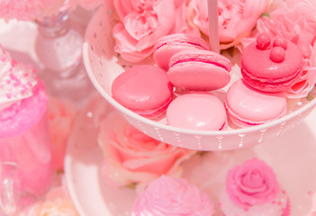 pink magaroons dessert in basket showcase at bakery