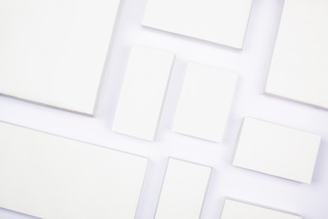 White cardboard boxes on a white background, concept of shopping and delivery. Many boxes of...