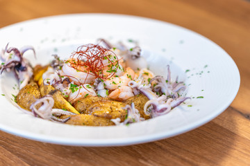 octopus dish with potatoes, very elegant, restaurant