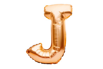 Letter J made of golden inflatable helium balloon isolated on white. Gold foil balloon font part of...