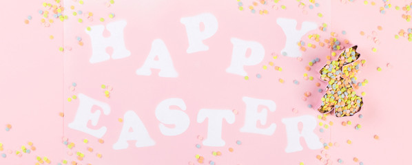 Happy Easter Greeting card with the inscription on a pink paper background.Concept of festive greetings