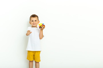 Cute little boy playing with a toy