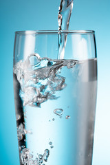 water flowing from bottle to glass