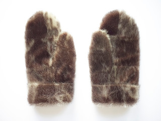 Close-up of elegant seal skin mittens isolated on white background. Extraordinary Danish gloves for cold climates.