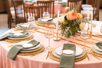 Elegant decor of a wedding bank in peach and green