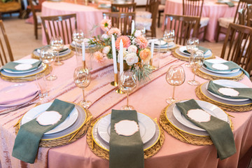 Elegant decor of a wedding bank in peach and green