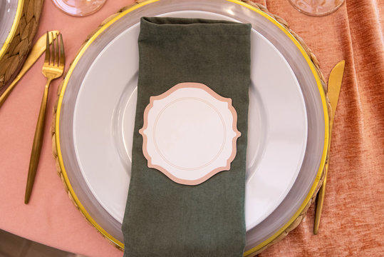 Elegant Guest Card On A Green Cloth Napkin