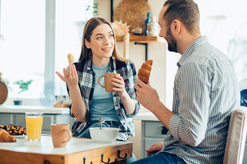 Expressive lady gesturing and man smiling stock photo