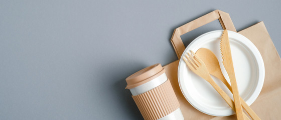 Eco-friendly travel cutlery set and bamboo coffee cup. Top view with copy space. Zero waste,...