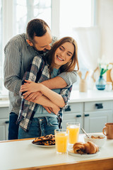 Loving couple in the kitchen before breakfast stock photo