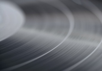 Black vinyl plate, selective focus, macro.