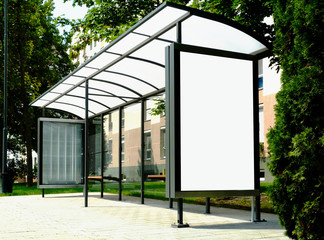 bus shelter at a busstop. blank billboard ad display. empty white lightbox sign. glass and aluminum...