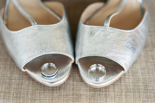 White Gold Wedding Rings On Silver Bridal Shoes