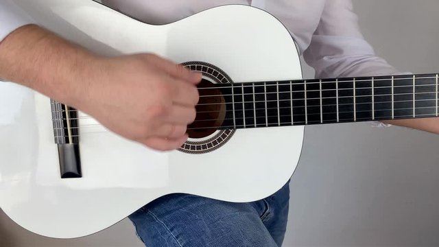 man in white shirt plays six-string classical guitar at home, concept art