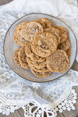 Oatmeal cookies on plate with lace and wood