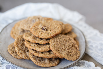 Oatmeal cookies on plate with lace and wood