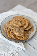 Oatmeal cookies on plate with lace and wood