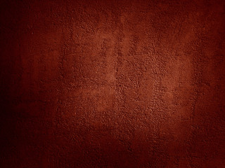Red abstract background. Toned rough concrete texture with cracks and scratches. Blood red background. Grunge or horror background.
