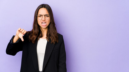 Young mixed race hispanic woman isolated showing thumb down and expressing dislike.