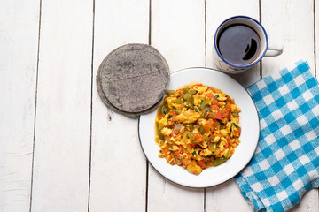 Mexican scrambled eggs with tomato and chili pepper also called 