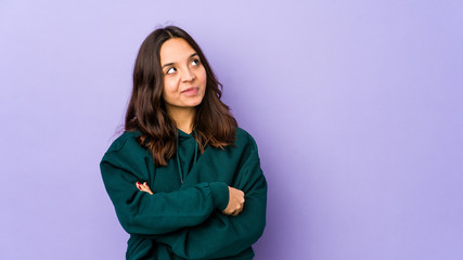 Young mixed race hispanic woman isolated dreaming of achieving goals and purposes