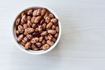Raw bean grains (Phaseolus vulgaris) displayed in bowl