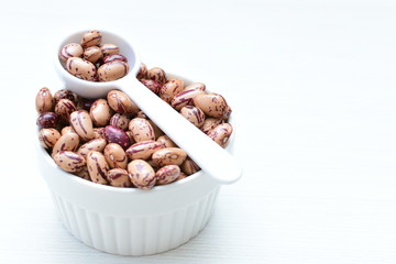 Raw bean grains (Phaseolus vulgaris) displayed in bowl