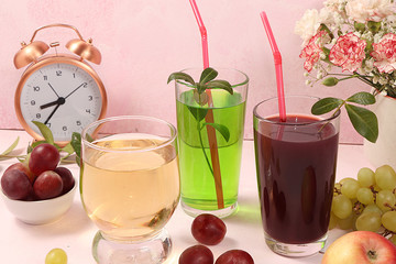 Fruit cocktail, cider, grape juices or fruit drinks in glasses and ingredients on a sunny table. The concept of detox diet and weight loss, healthy and natural nutrition, bar. Healthy breakfast, 