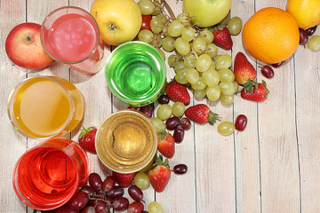 Fruit cocktail, cider, grape juices or fruit drinks in glasses and ingredients on a sunny table. The concept of detox diet and weight loss, healthy and natural nutrition, bar. Healthy breakfast, 