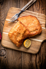 Two fried cod fillet pieces.