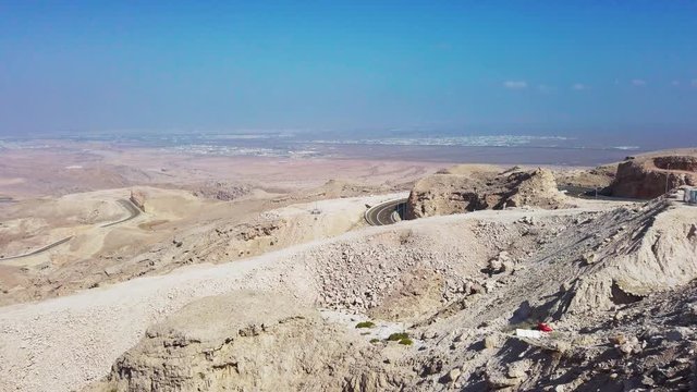 Pan shot of the desert in Dubai in the road to Jabel Hafeet Al Alin.