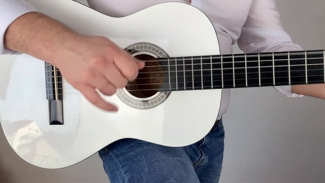 man in white shirt plays six-string classical guitar at home, concept art