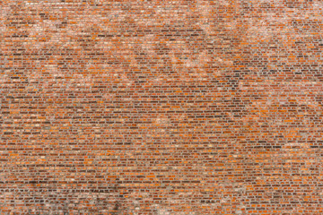 Background image of a large brick wall.