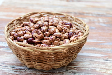 Raw bean grains (Phaseolus vulgaris) displayed in bowl