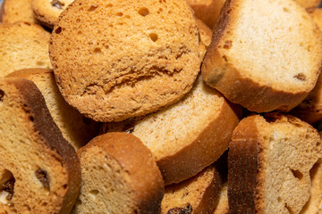 Fresh small oval brown bread crackers, hard chuck closeup. 