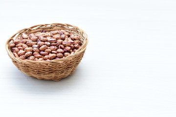 Fototapeta na wymiar Raw bean grains (Phaseolus vulgaris) displayed in bowl